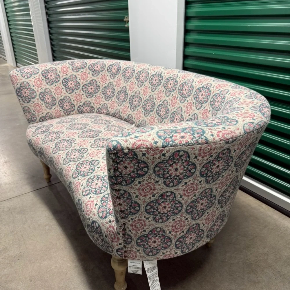 Elegant Patterned Sofa with Pink and Blue Accents